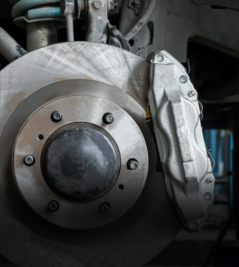 Up close to brakes in vehicle | Roe Jan Auto Center LLC