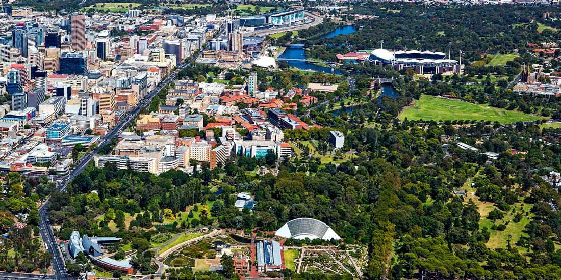 Aerial photo of tree areas next to city