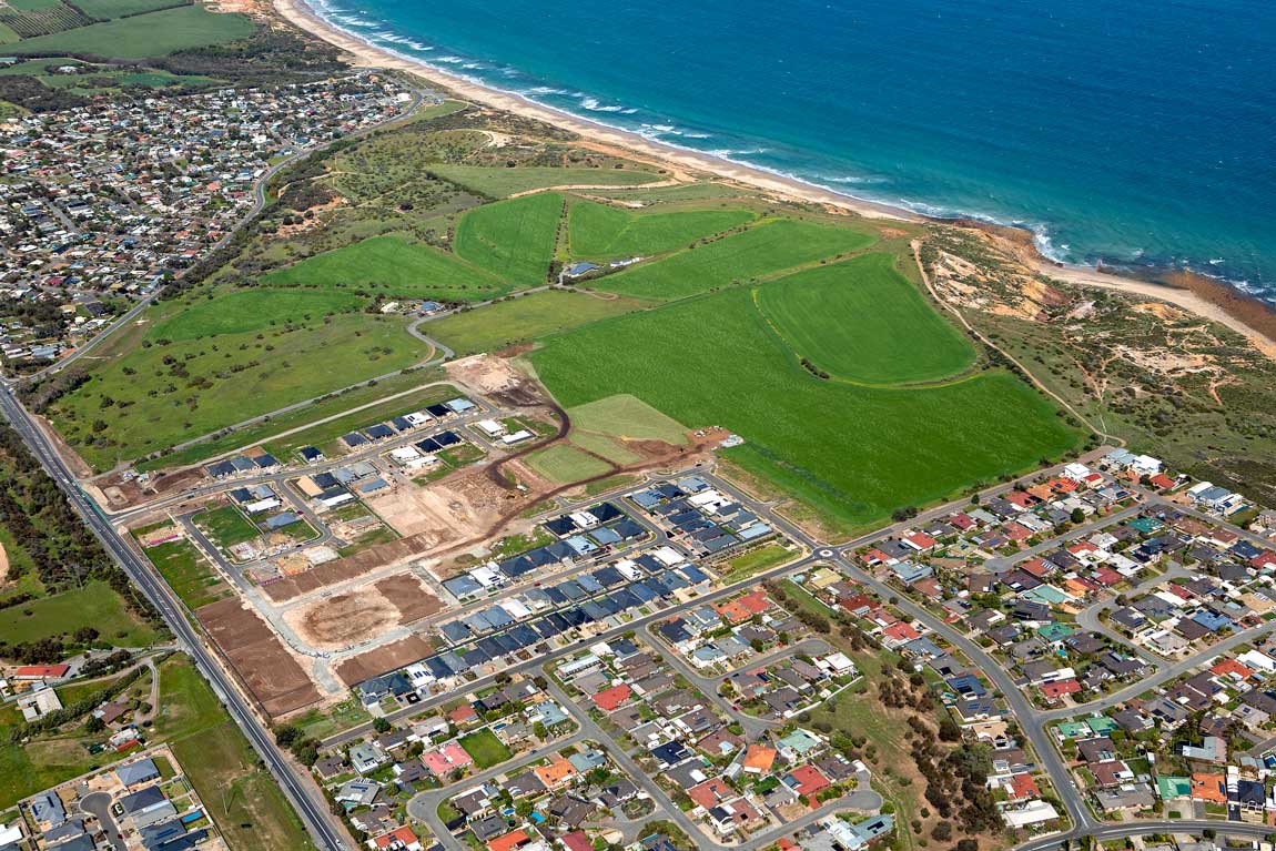 Aerial photo of residential area next to big grassy area