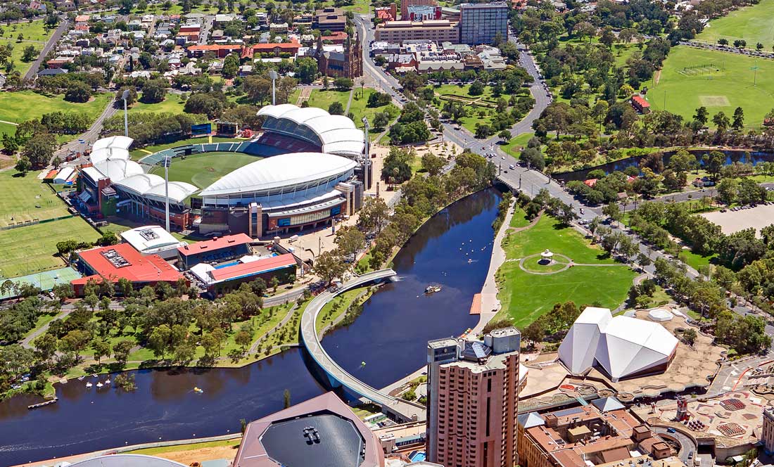 Aerial photo of body of water next to shopping area