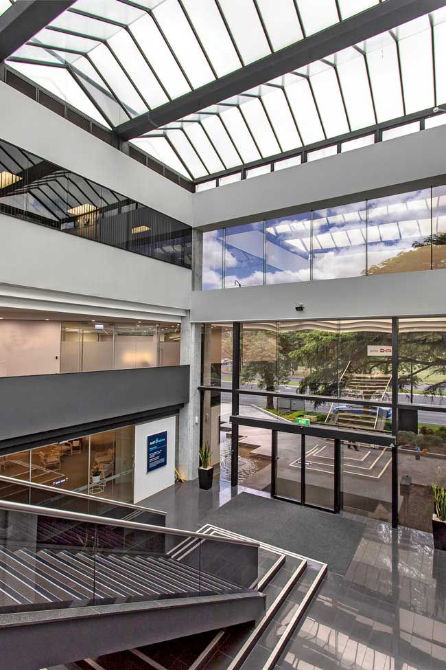Architectural photo of office building from atop the stairs