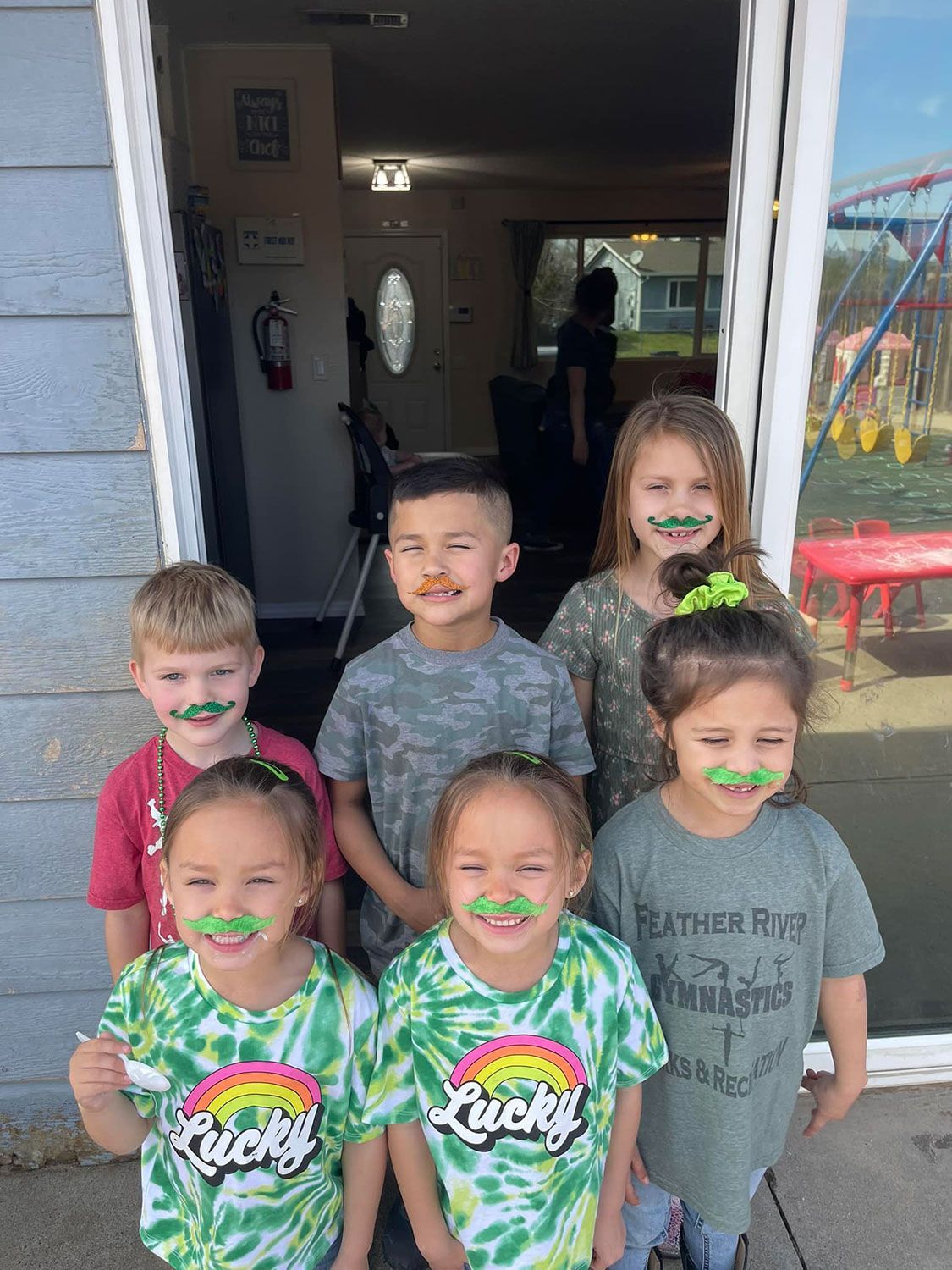 Kids Sitting in the Locker Area — Oroville, CA — Angela's Family Day Care