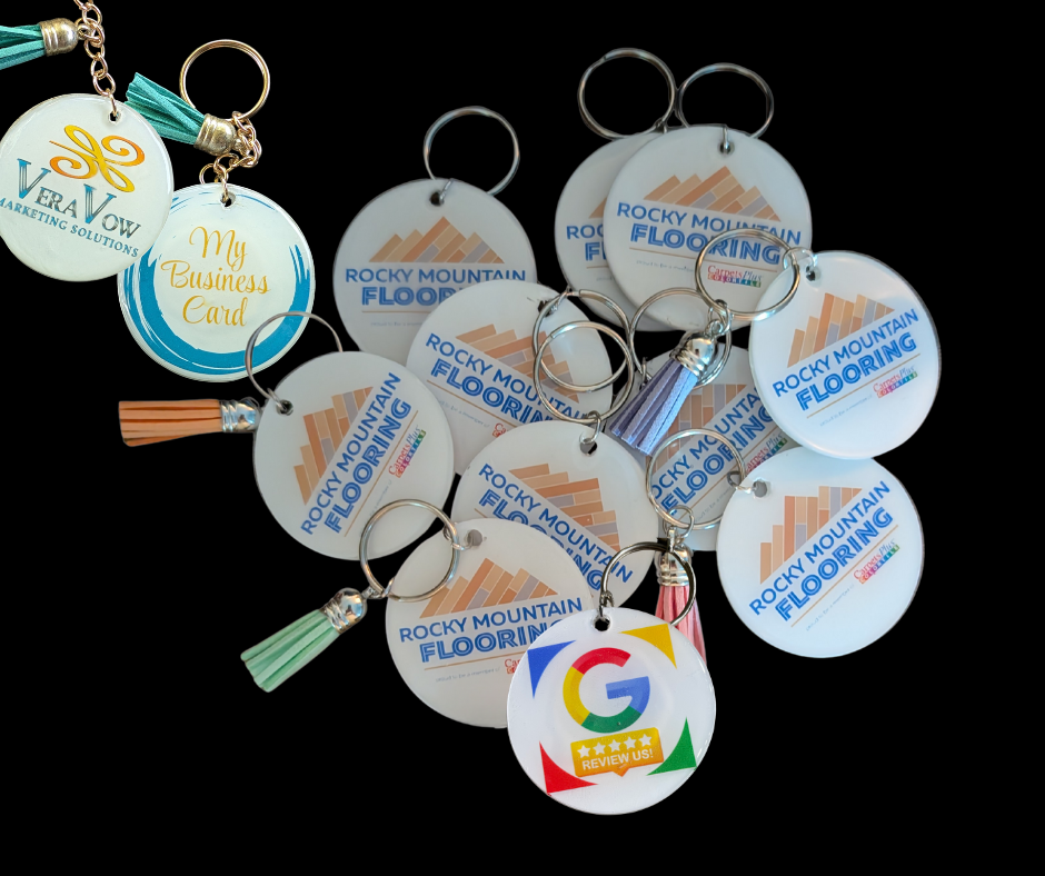 A bunch of rocky mountain flooring keychains on a black background