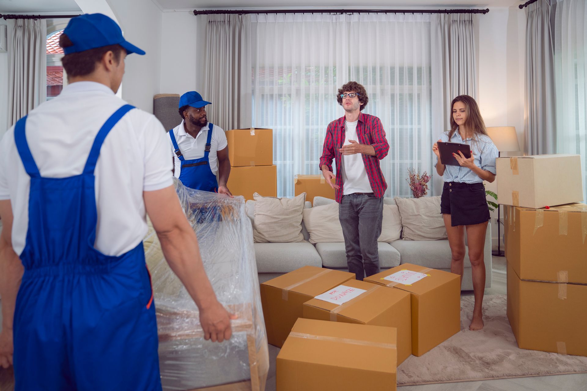 A group of people are moving into a new home.