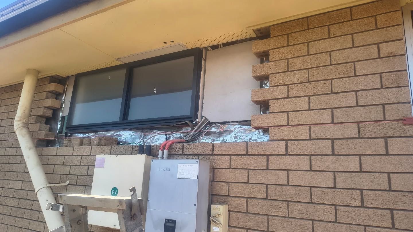 Exterior House Wall With A Window, Partial Brick Missing — Bricks By Dre In Oxenford, QLD