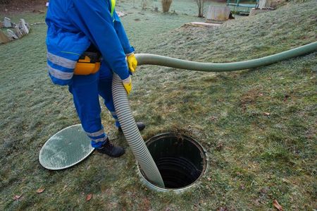 Holding Huge Hose to Clean Sewers — Land O' Lakes, FL — Optimum Plumbing