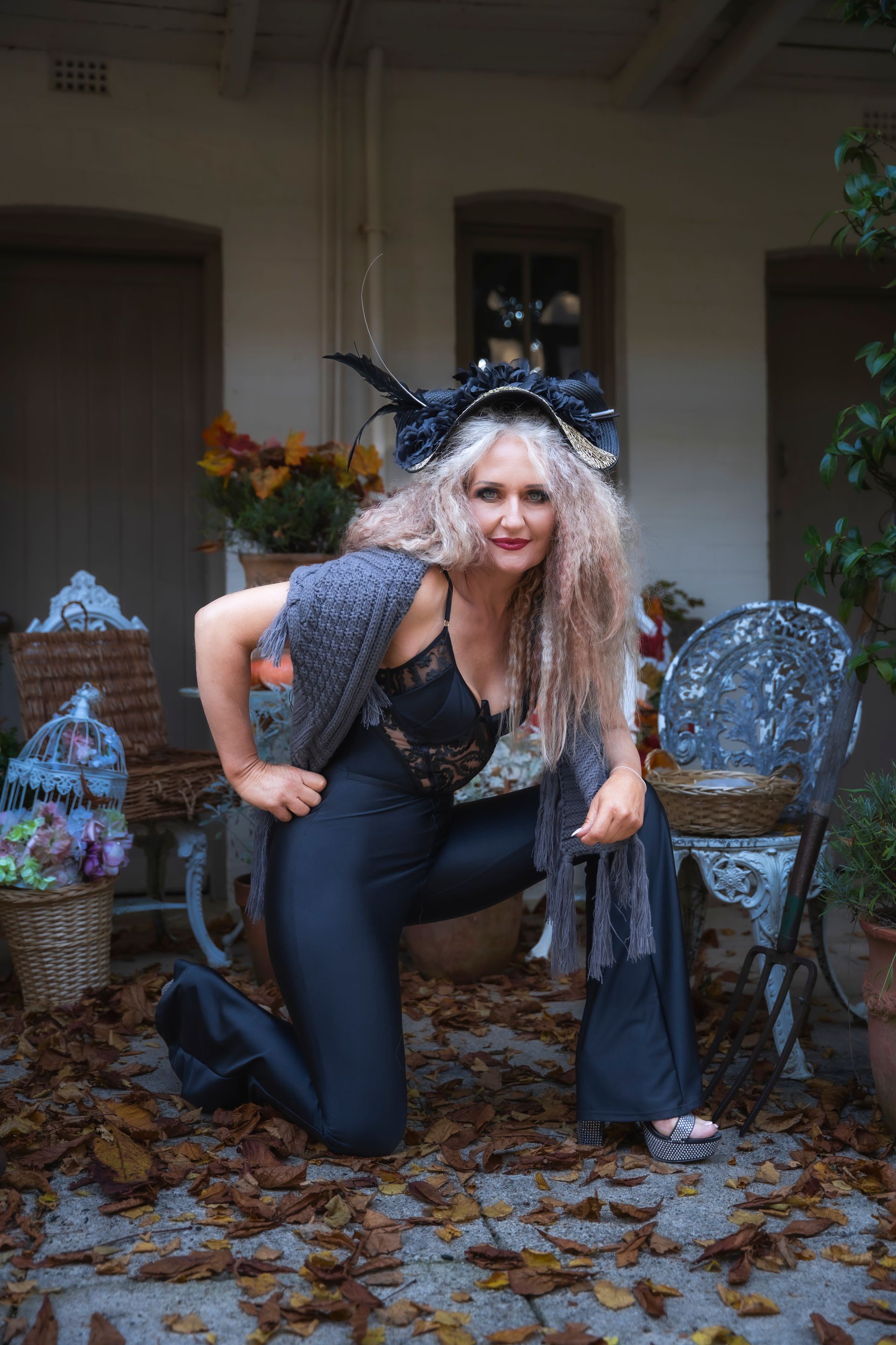 Raven Gold Fascinator. Made from a Polypropylene, flowers, sticks and feathers on a thick headband.