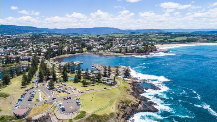 An Aerial View Of A City Next To A Body Of Water — Sal's Excavations In Kiama, NSW