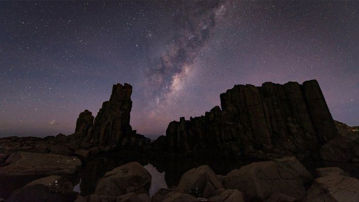 The Milky Way Is Visible Over A Rocky Cliff At Night — Sal's Excavations In Kiama, NSW