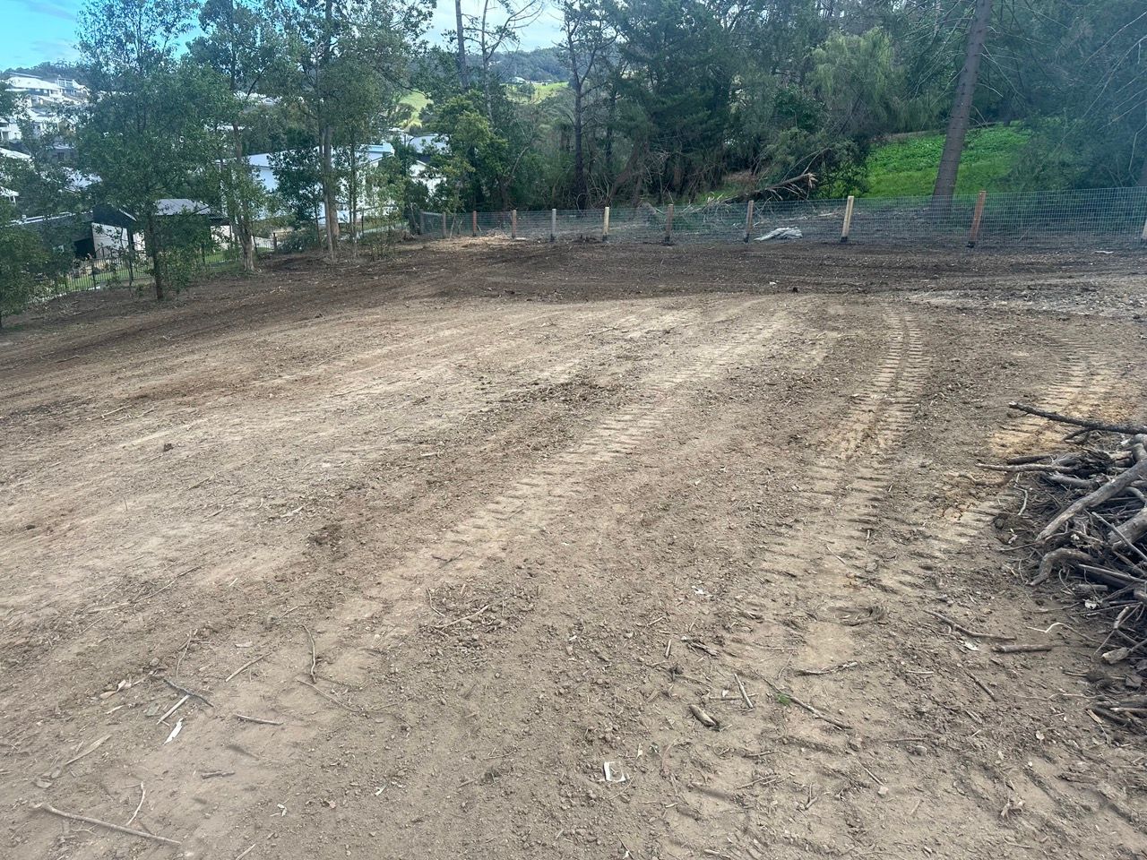 A Yellow Bulldozer Is Sitting In The Middle Of A Dirt Field — Sal's Excavations In Falls Creek, NSW