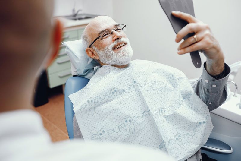 Two men in the dentist's office — Denture Relining in Newcastle, NSW