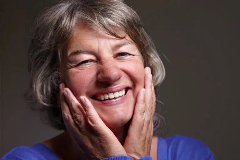 Content female senior citizen smiling — Denture Clinic in Hamilton, NSW