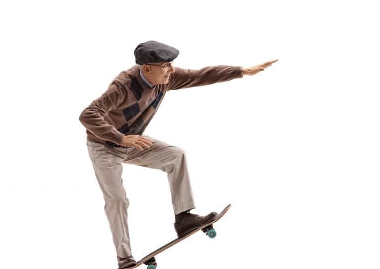 Elderly Man Riding A Skateboard — Denture Relining in Newcastle, NSW
