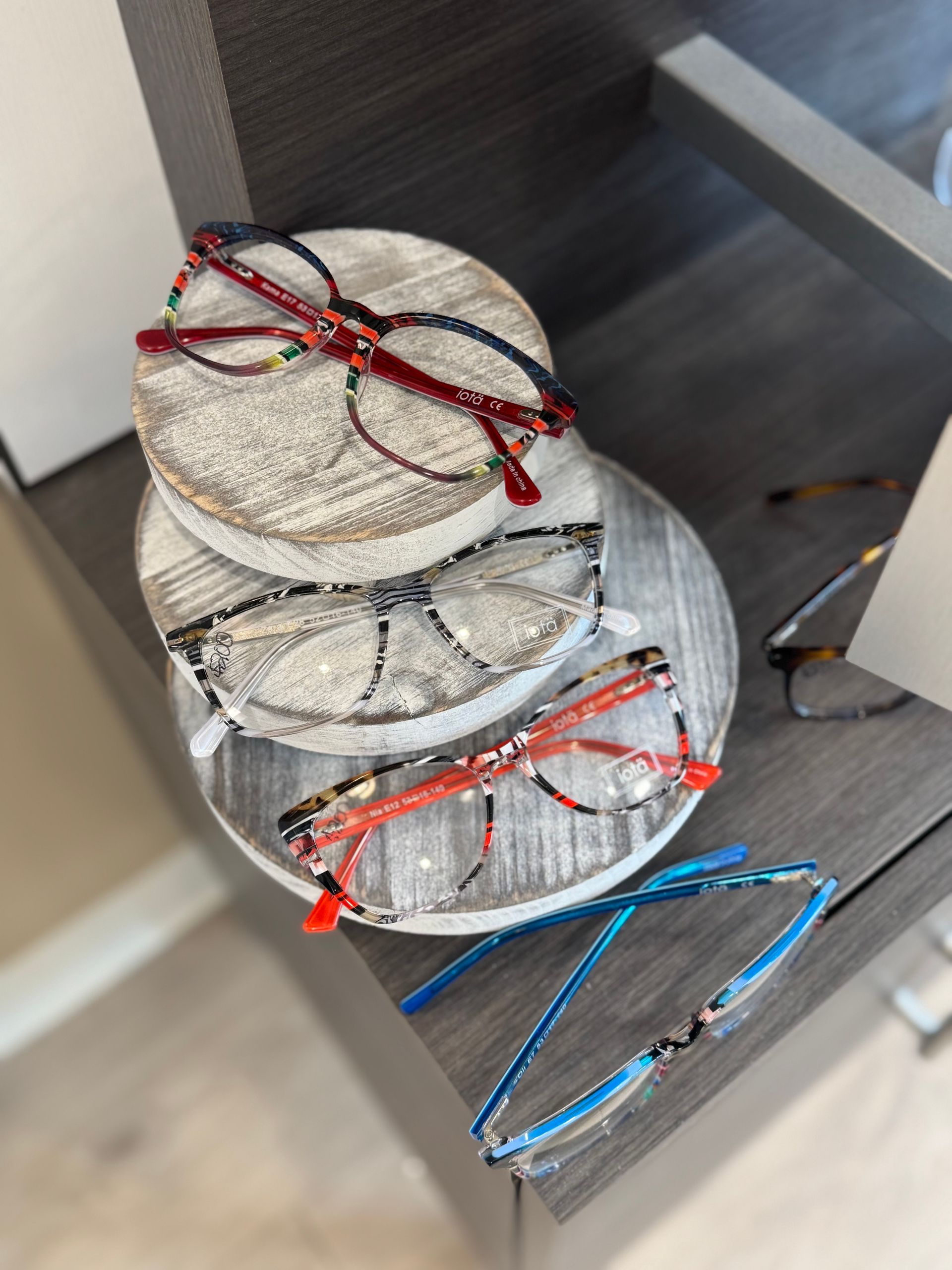A stack of glasses sitting on top of each other on a table.
