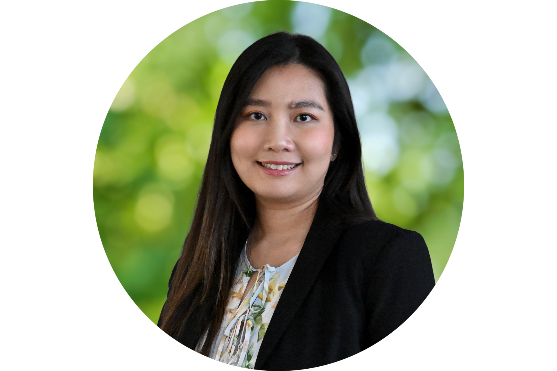 A woman in a black jacket is smiling in a circle.