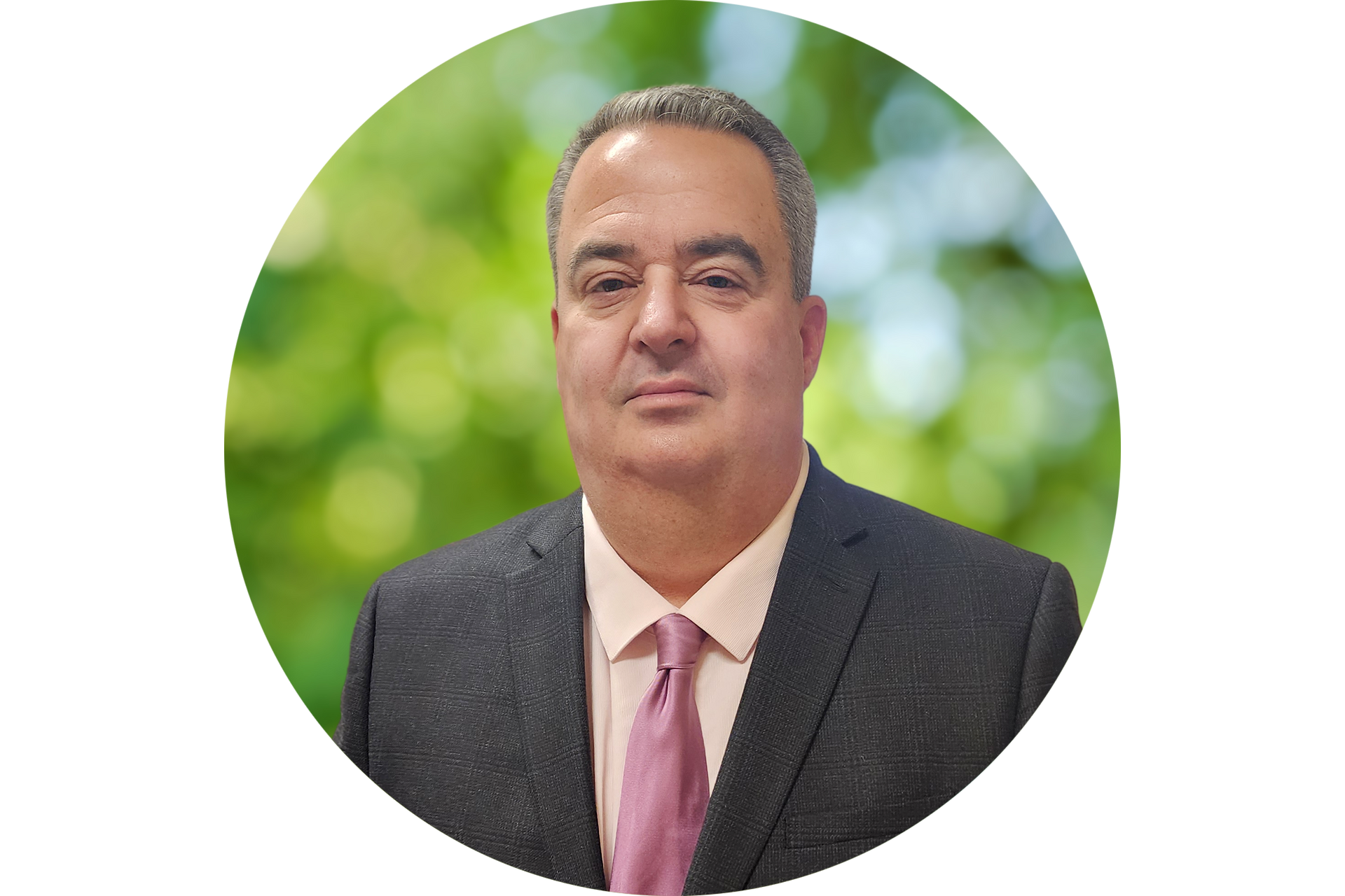 A man in a suit and tie is standing in a circle.