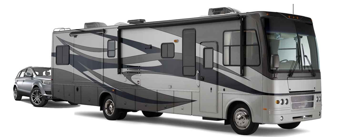 A large rv is towed by a truck on a white background.