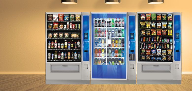 A vending machine with a clock on the front of it