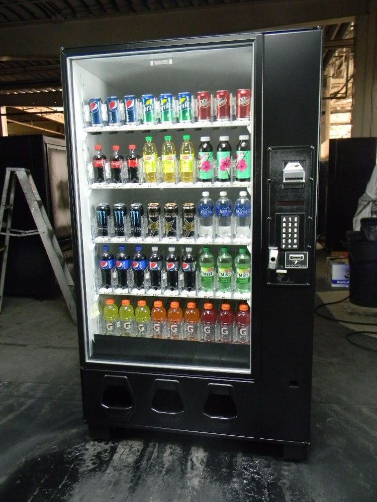 A vending machine filled with sodas and cans