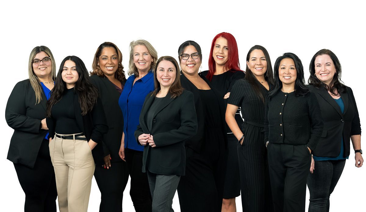 A group of women are posing for a picture together.
