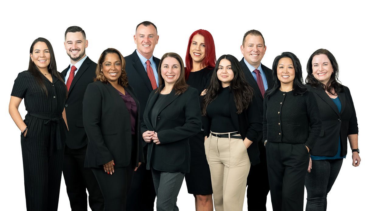 A group of people in suits and ties are posing for a picture.