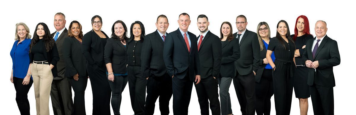 A group of people in suits and ties are posing for a picture.