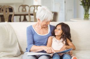 Grandmother and Granddaughter Looking at Photo Album — Lehi, UT — Bellaview Assisted Living