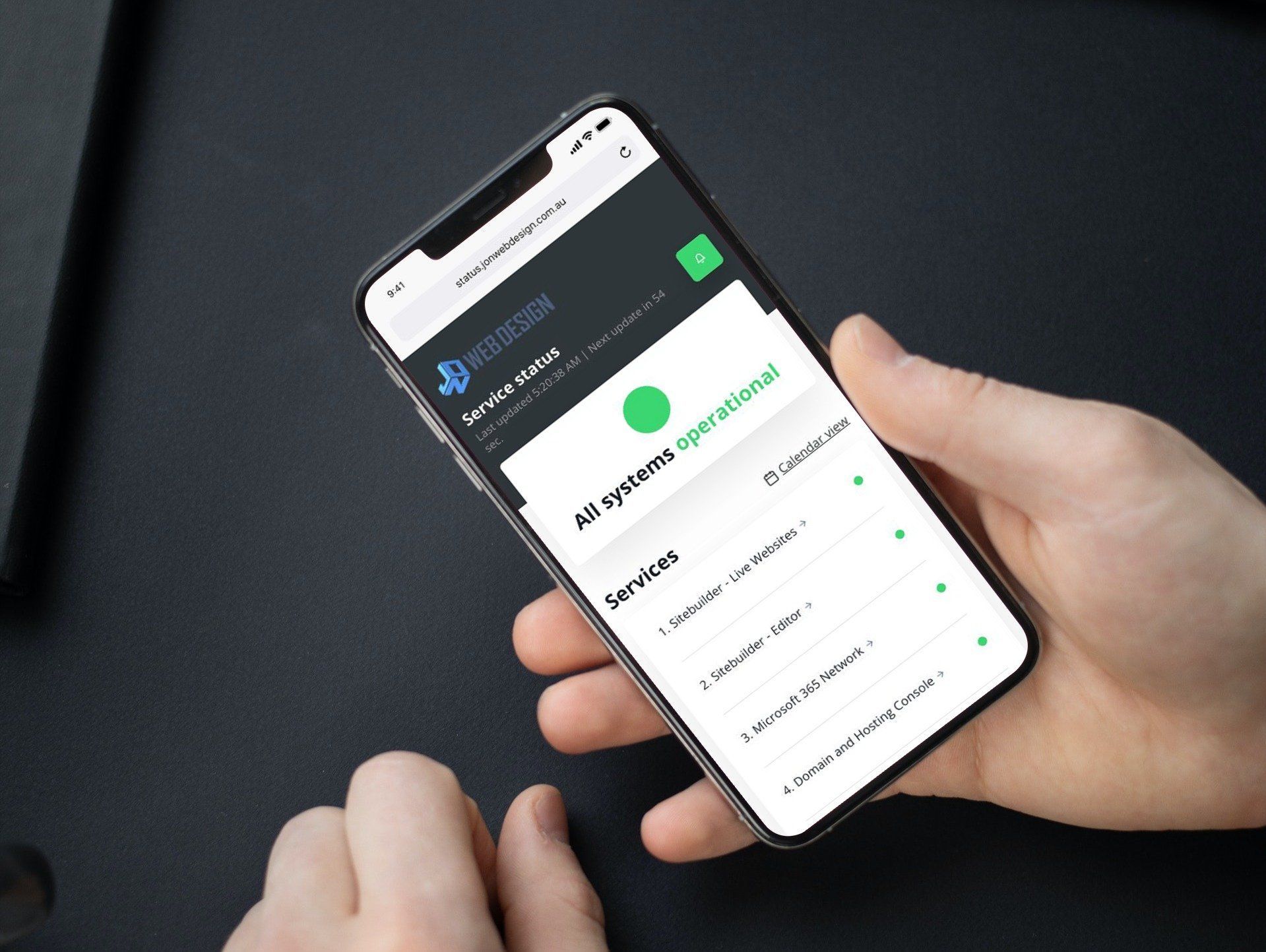 a person is holding a mobile phone with a screen that has a Status Page on it