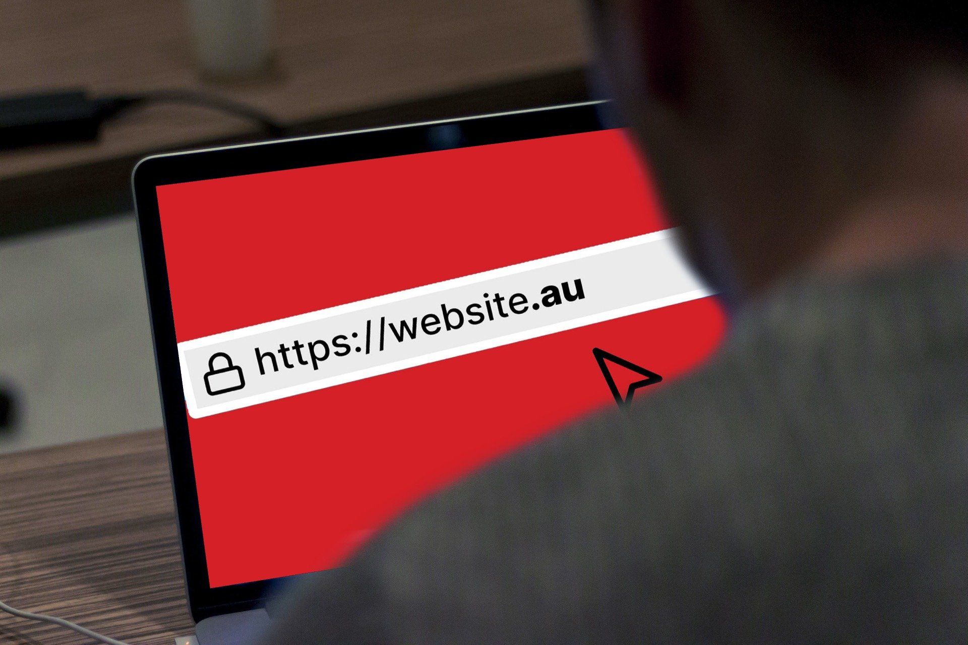 a person is looking at a laptop that says https://website.au