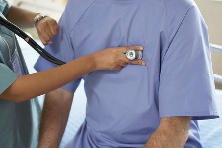 Doctor checking patient with stethoscope — Family Medicine in Fayetteville, NC
