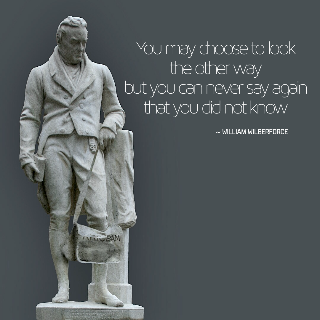 Marble sculpture of William Wilberforce holding a KRIOBAM bag