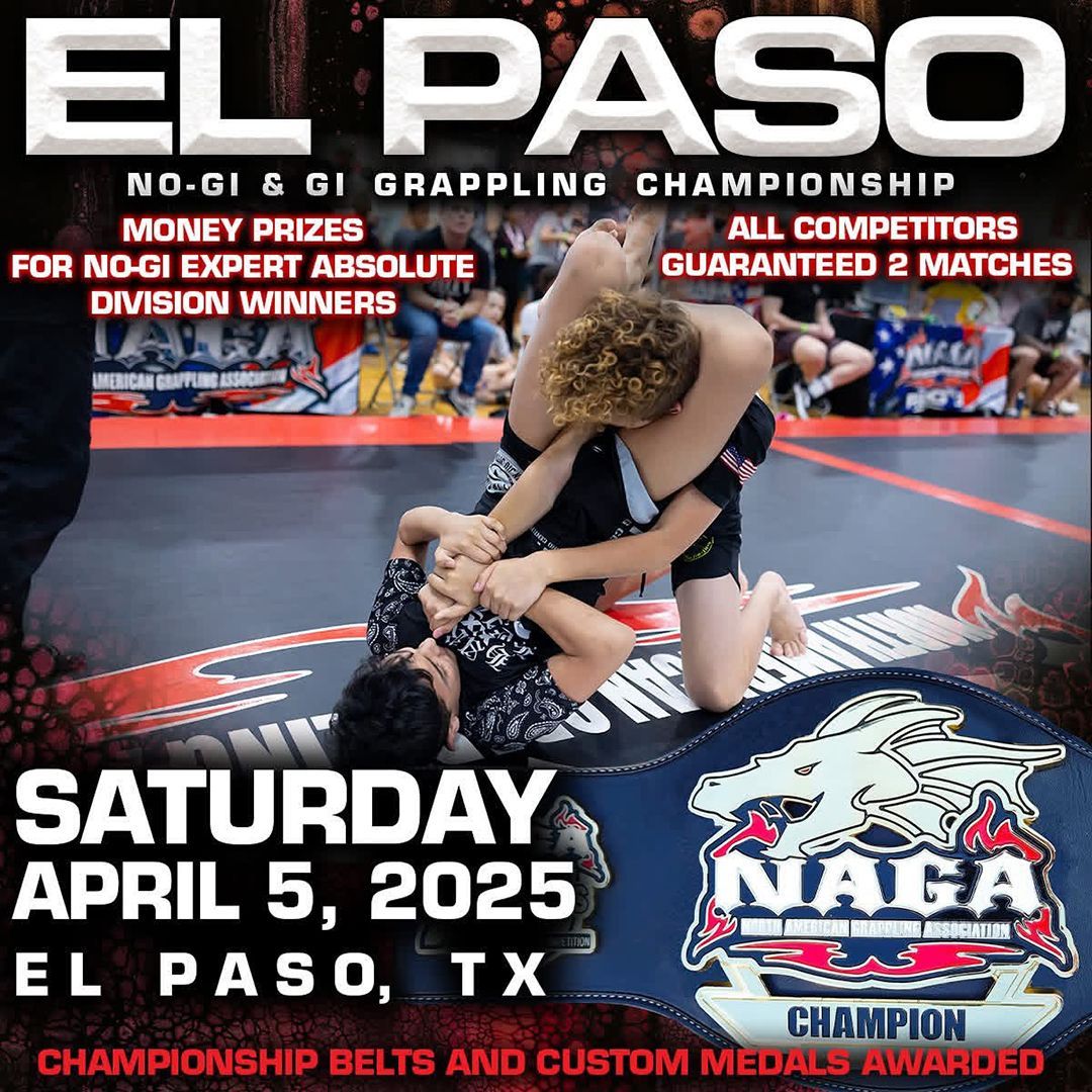 Two men grappling in a fighting ring. One has the other in a headlock.