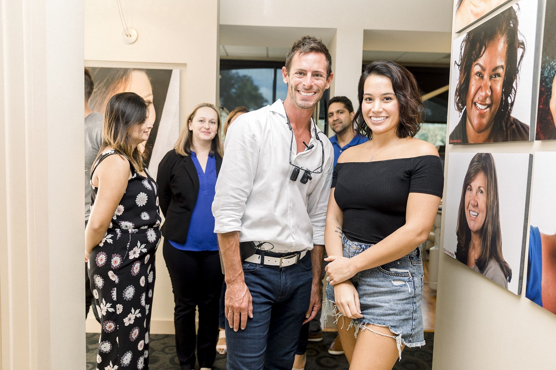 Dr. Olitsky and a woman are posing for a picture in a hallway