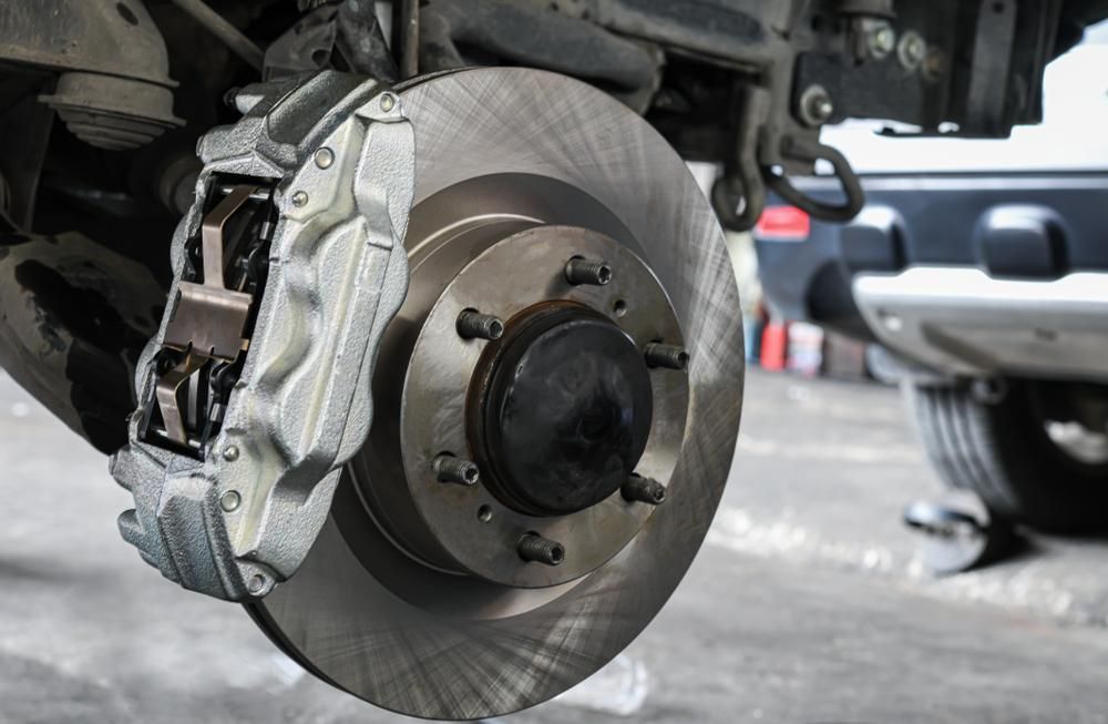 A Close Up Of A Brake Disc On A Car — McDonald Automotive Services In Islington, NSW