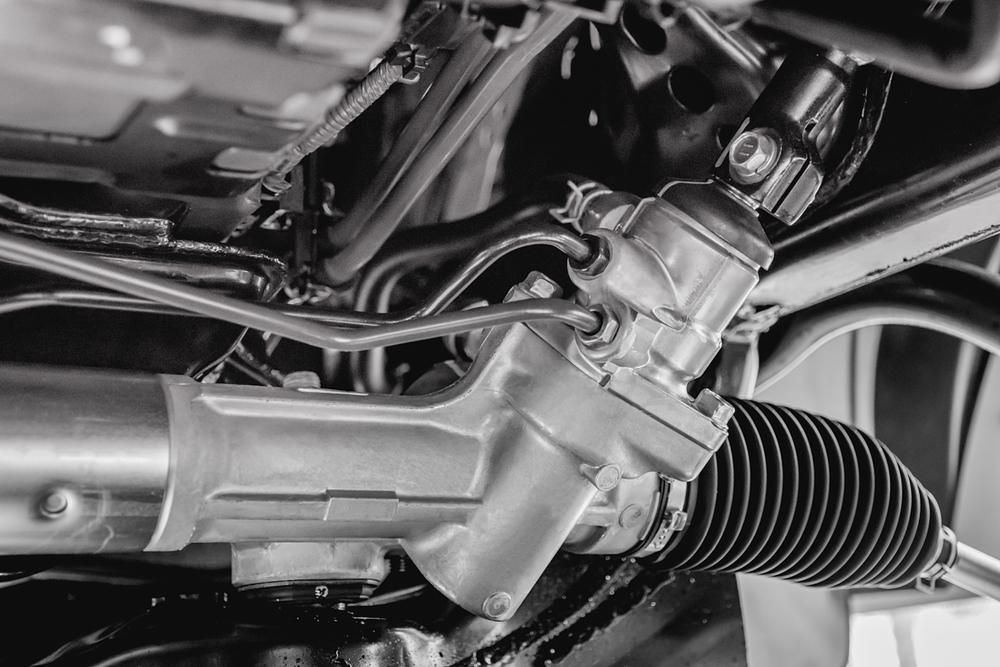 A Black And White Photo Of A Steering Rack On A Car — McDonald Automotive Services In Islington, NSW