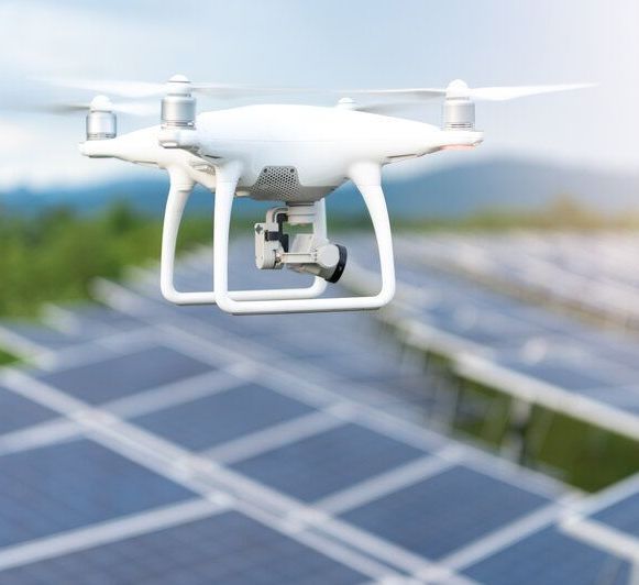 drone buzzing over solar field