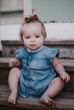 Milestone Photography of baby girl in denim  in Chandler, Arizona.