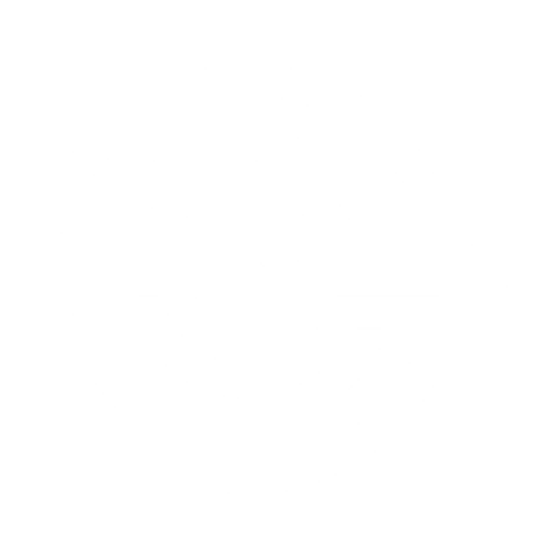 Man with long gray beard and sunglasses wearing headphones, typing on a laptop.