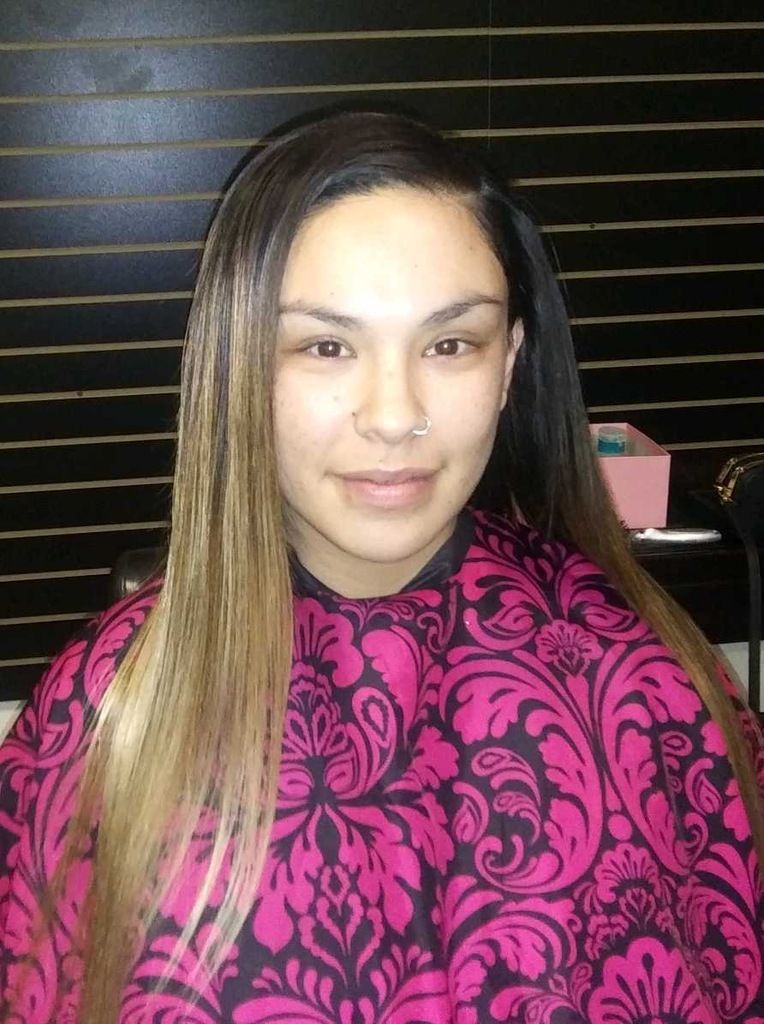 A Woman With Long Hair Is Wearing A Pink Cape