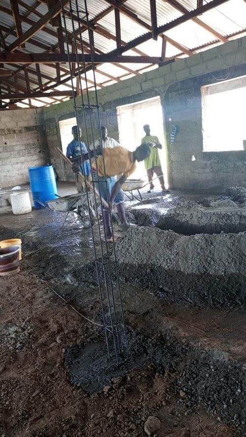 A group of people are working on a construction site.