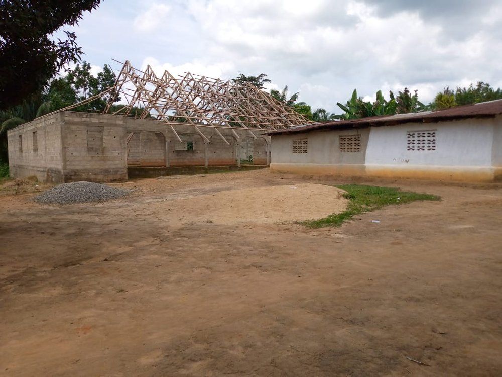A building under construction with a wooden roof