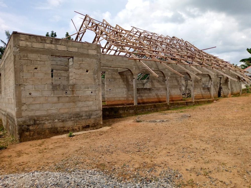 A building under construction with a wooden roof