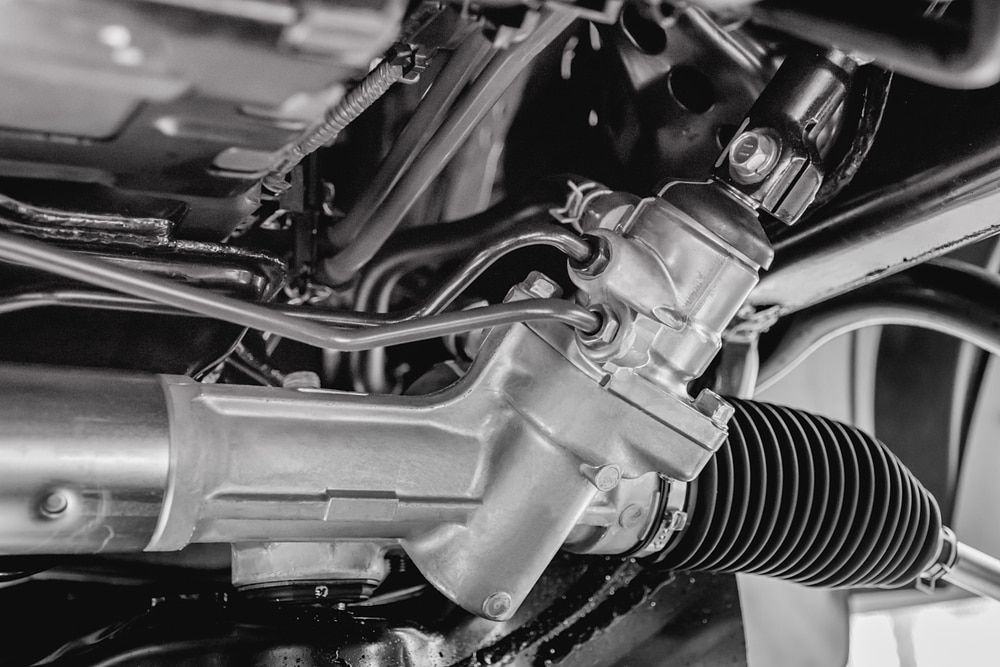 A Black and White Photo of a Steering Rack on a Car — Brittle's Family Auto Centre in Moffat Beach, QLD
