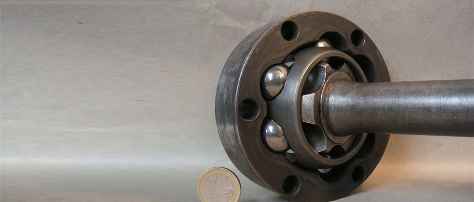 A Close Up of a Metal Object With a Coin Next to It — Brittle's Family Auto Centre in Sunshine Coast, QLD