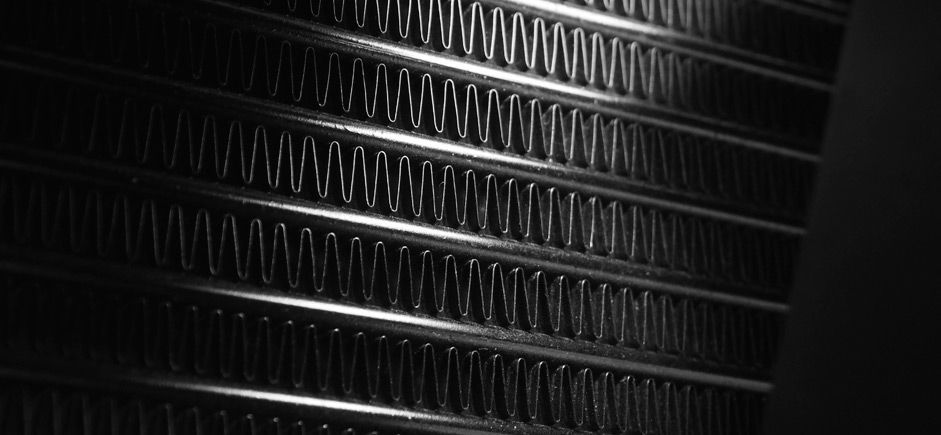 A Close Up of a Metal Radiator in a Black and White Photo — Brittle's Family Auto Centre in Sunshine Coast, QLD