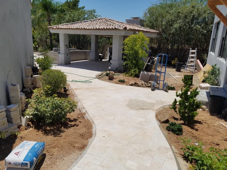 A bag of sika cement sits on the side of a driveway