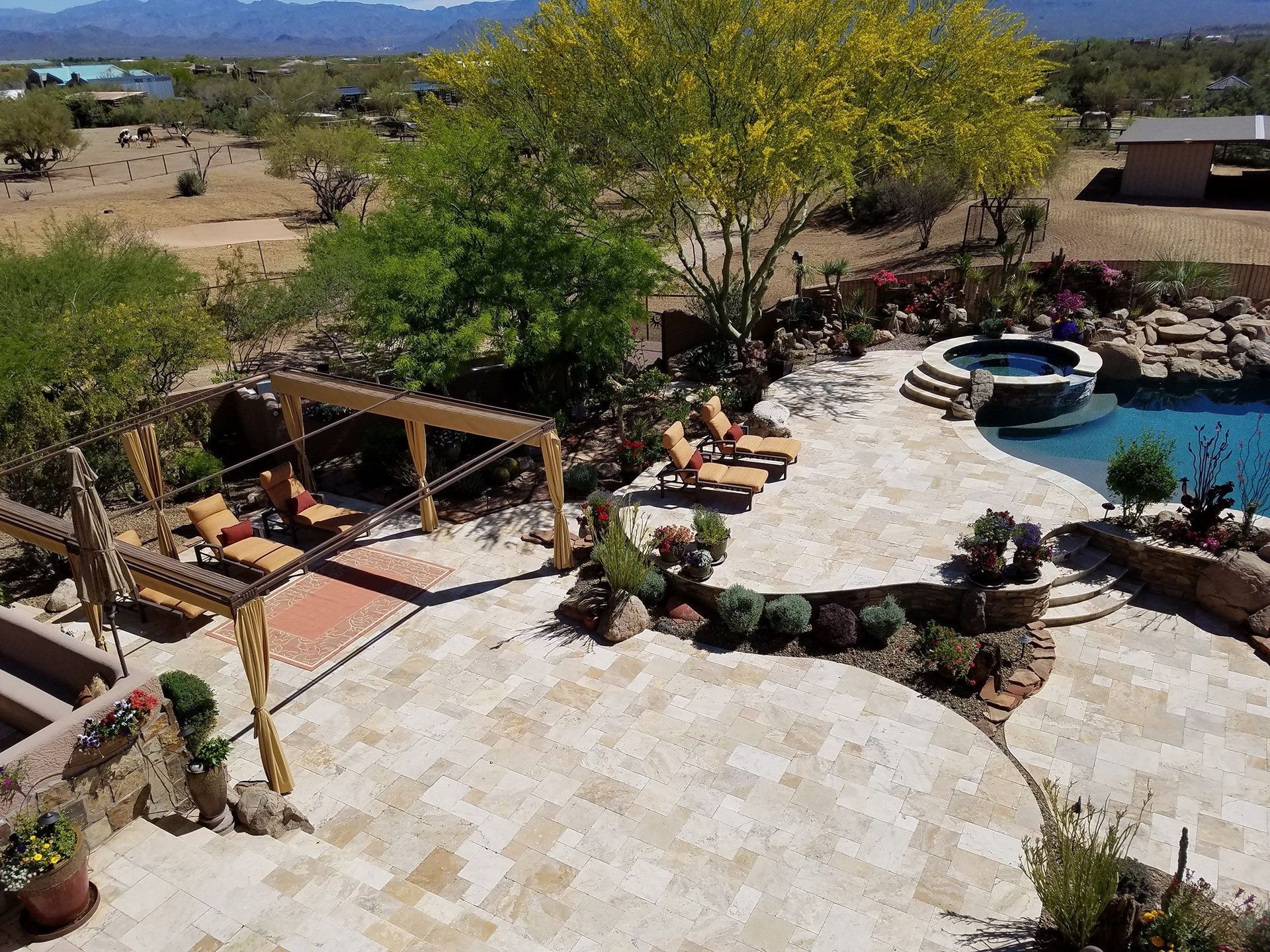An aerial view of a large backyard with a swimming pool