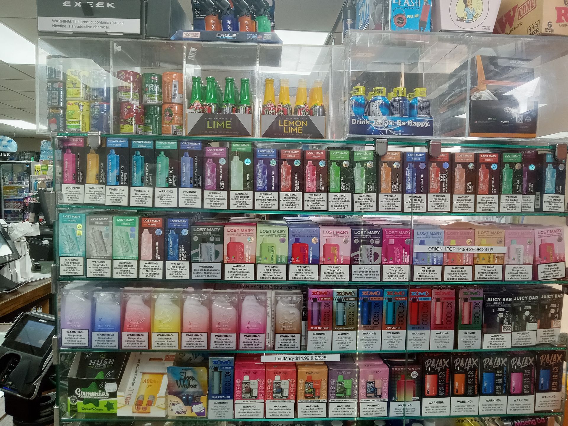 A store shelf filled with a variety of electronic cigarettes.
