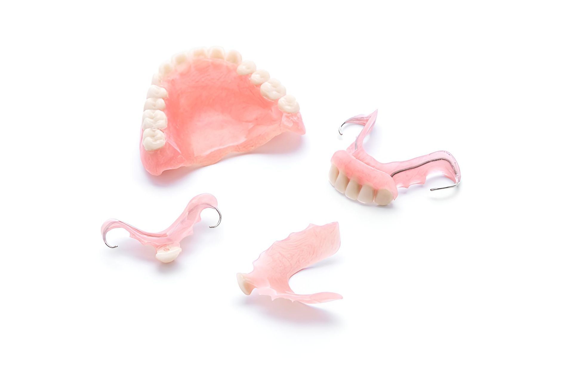 A Set of Broken Dentures on a White Background — Trower Dental In Casuarina, NT