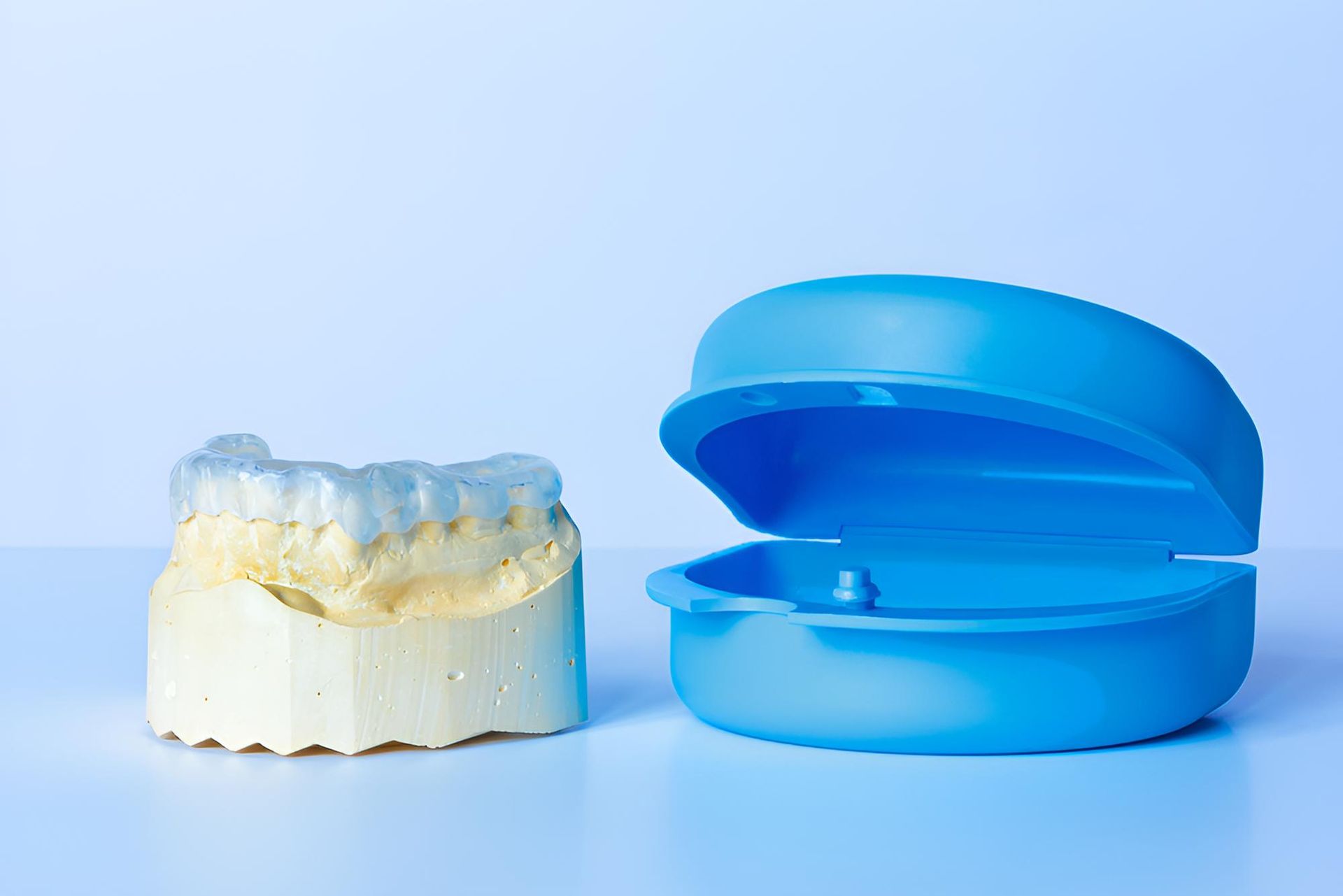 A Model of a Tooth and a Blue Box on a Table — Trower Dental In Casuarina, NT